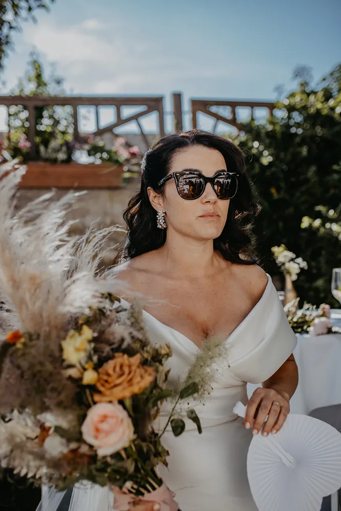 Bride with sunglasses and elegant dress